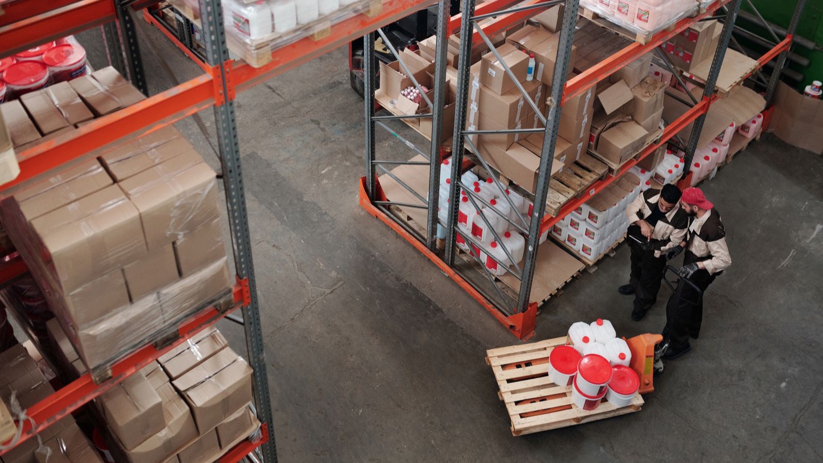 Workers checking products and shipments in a warehouse