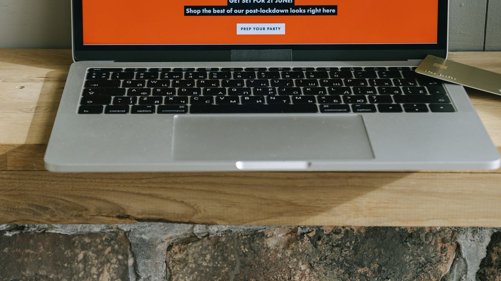 Online storefront with product cards displayed on a laptop