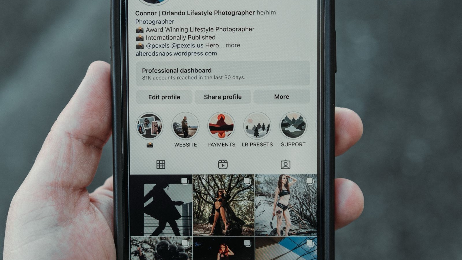 An Instagram profile displayed on a handheld smartphone