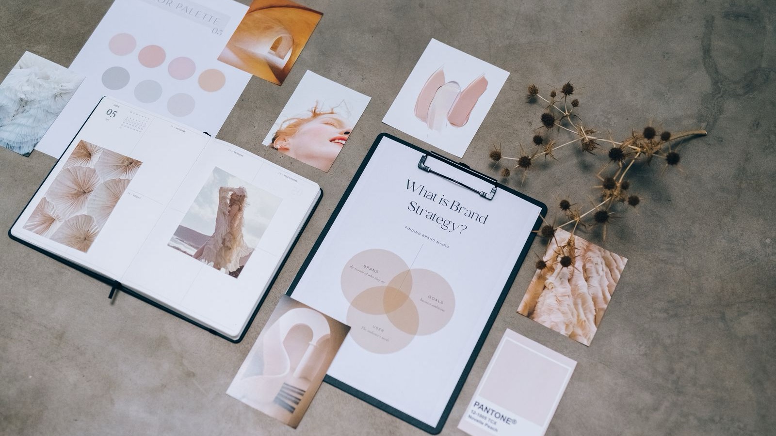 Brand documents and image cards arranged side by side on a table