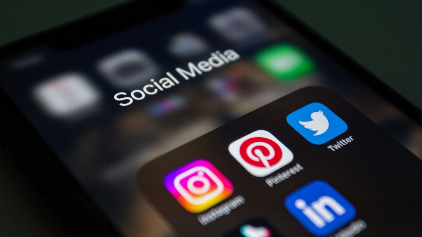 A folder of social media applications on a smartphone screen