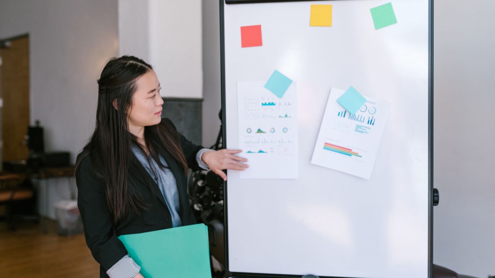 Technical Feasibility: Map the Risks Before Software Development A person presenting an explanation beside a whiteboard