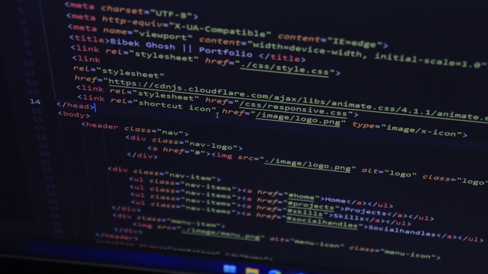 High-resolution close-up of HTML code displayed on a computer screen, perfect for technology themes.