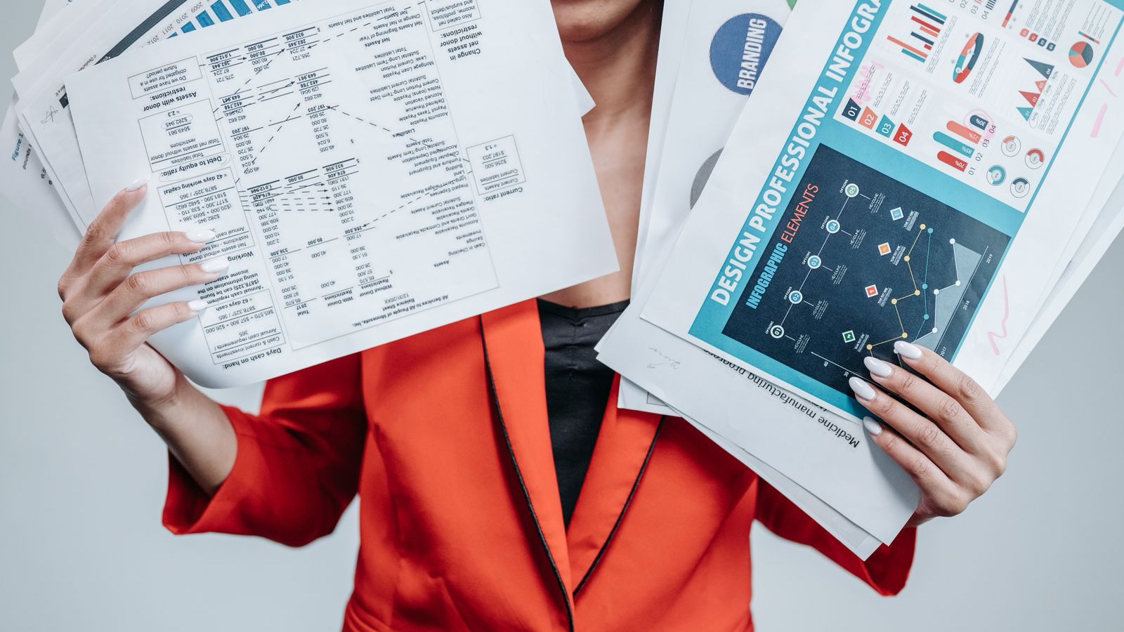 Software project cost: what a screen count leaves out A person holding business documents and chart pages